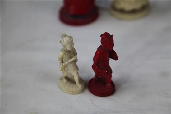 A 19th century Macau carved and stained ivory chess set, king 4.75in.